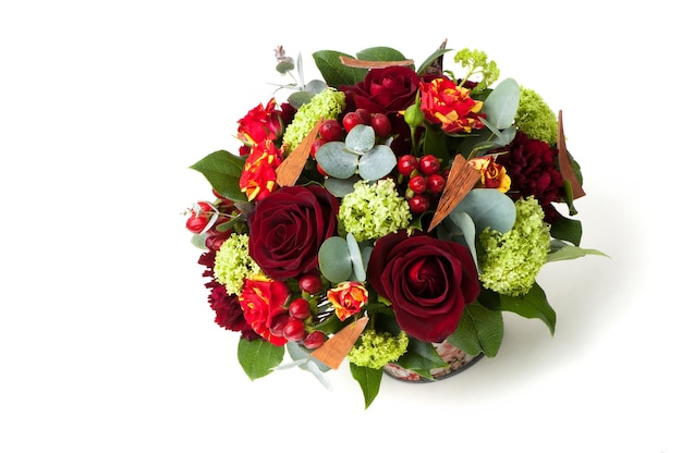 Red roses and an assortment of flowers in a pot. Valentine's Day