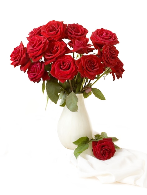 red roses bouquet in vase and fabric