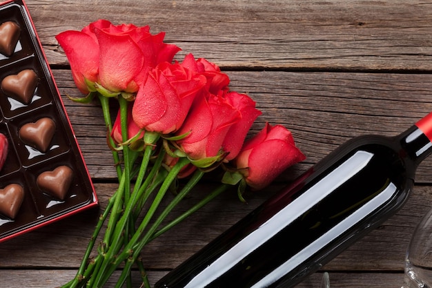 Red roses wine bottle and chocolate box