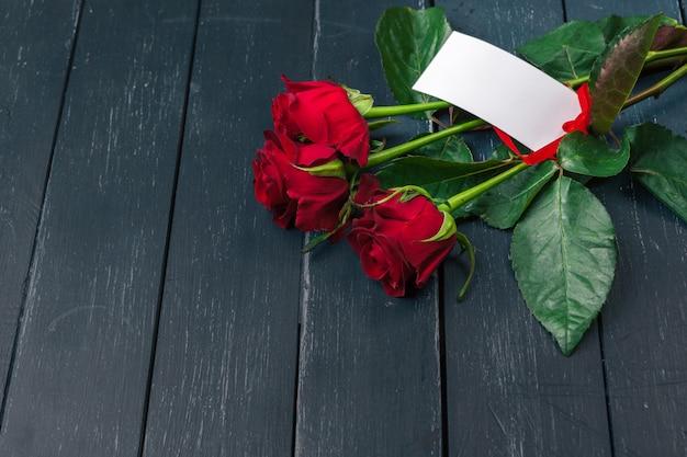 Photo red roses with message card. valentines day