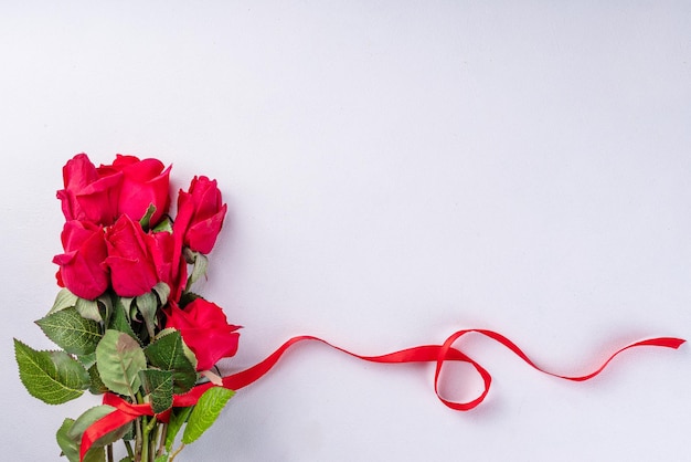 Red roses with red ribbon bow