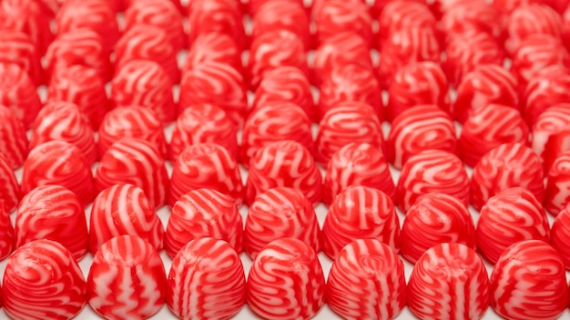 Red round tasty gummy candies as a background