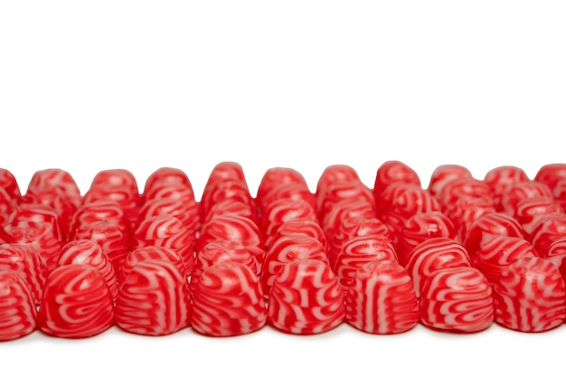 Red round tasty gummy candies islolated on a white background