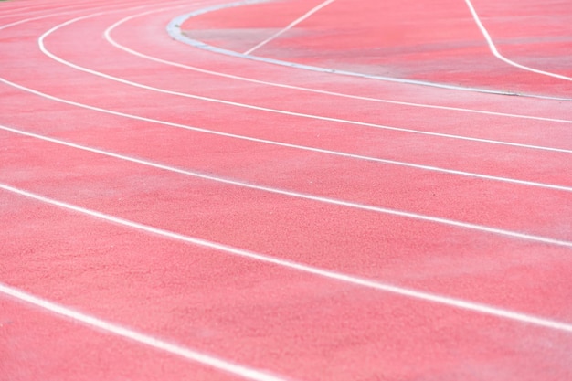 Red rubberized running track fueling their exercise at sports ground place to rest and activities