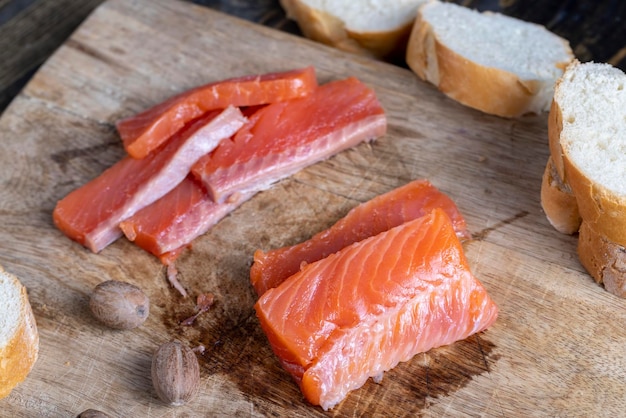 Red salted salmon fish meat on a chopping board salted salmon fish that is used for sushi and other Asian dishes