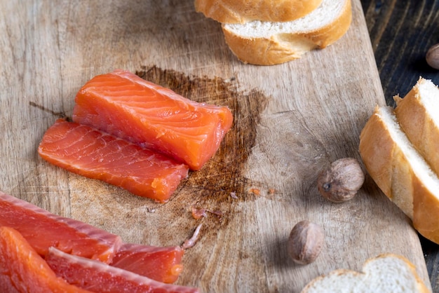 Red salted salmon fish meat on a chopping board