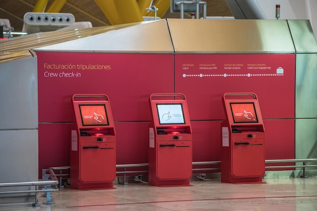 Red self machines checkin service at the airport kiosk