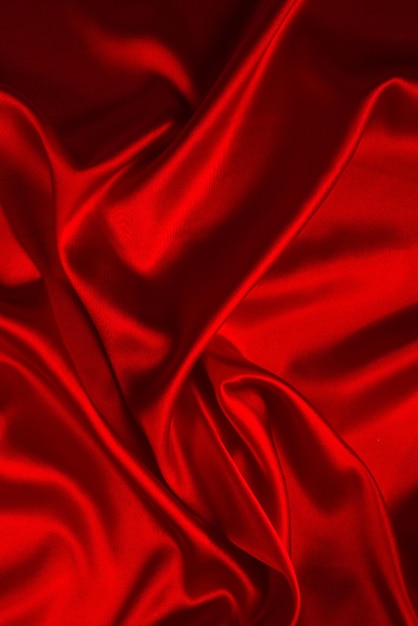 Red silk or satin luxury fabric texture can use as abstract background Top view