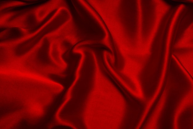 Red silk or satin luxury fabric texture can use as abstract background