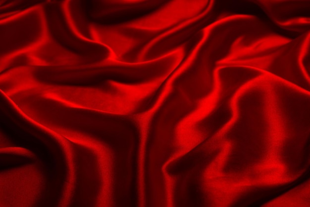 Red silk or satin luxury fabric texture can use as abstract background