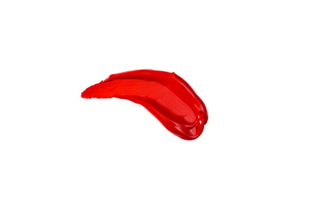 Red smear lipstick cosmetics on a white background Top view flat lay