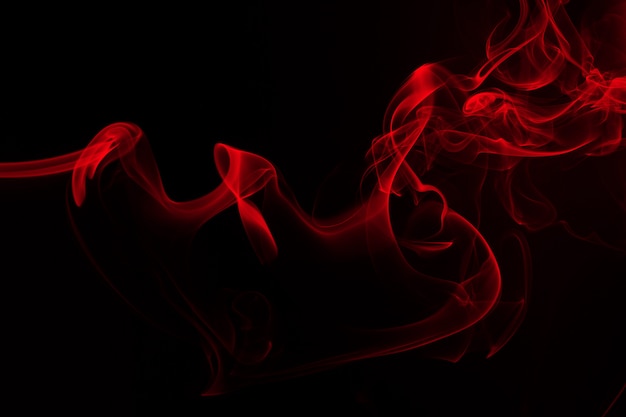 Red smoke abstract on black background. fire design