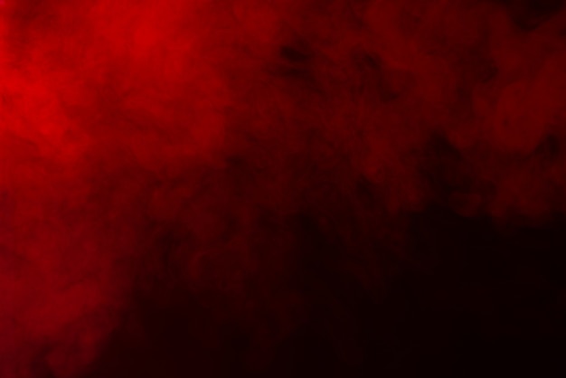 Red smoke on black background