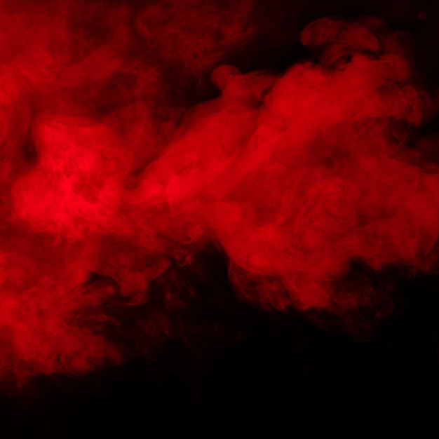 Red smoke on black background