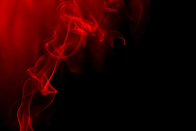 Red smoke on black background