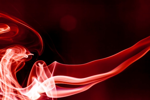 Red smoke motion on black background.