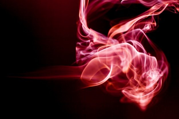 Red smoke motion on black background.