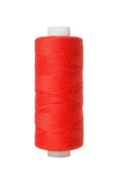 Red spool of thread isolated