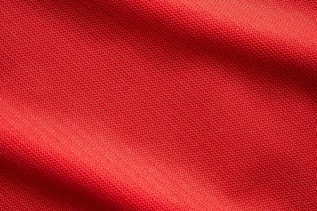 Red sports clothing fabric football jersey texture close up