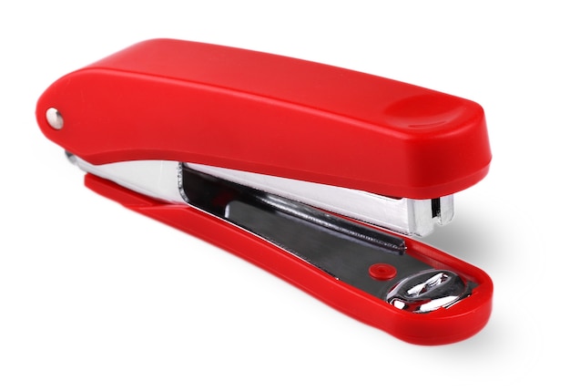 Red stapler isolated on a white background.