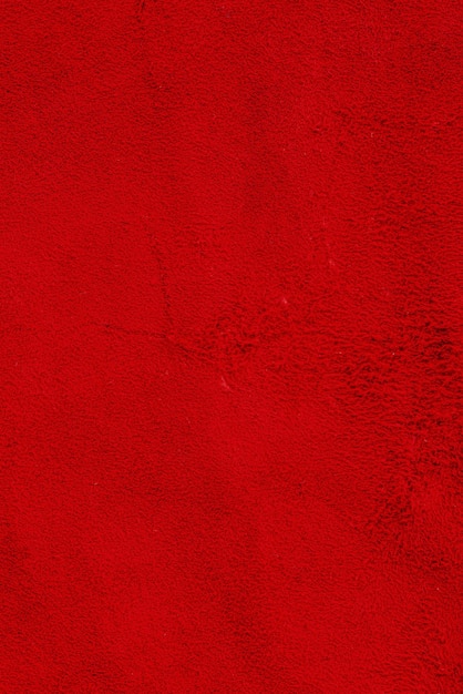 Red suede genuine leather background Velvet red background closeup photo