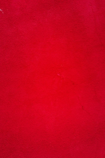 Red suede genuine leather background Velvet red background closeup photo