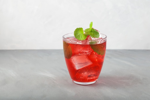 Red summer refreshing soft drink with ice or fruit iced tea