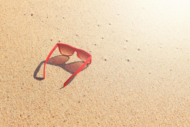 Red sunglasses on the beach