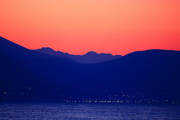 red sunset in the mountains, landscape nature silhouette of mountains at sunset, summer look