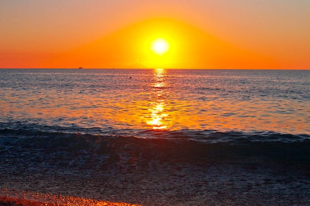 Red sunset over the sea. Beautiful sunset. Tyrrhenian Sea sunset in Calabria, Italy.