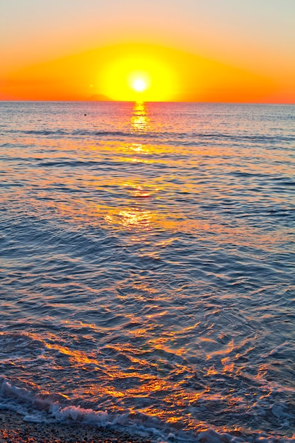 Red sunset over the sea. Beautiful sunset. Tyrrhenian Sea sunset in Calabria, Italy.