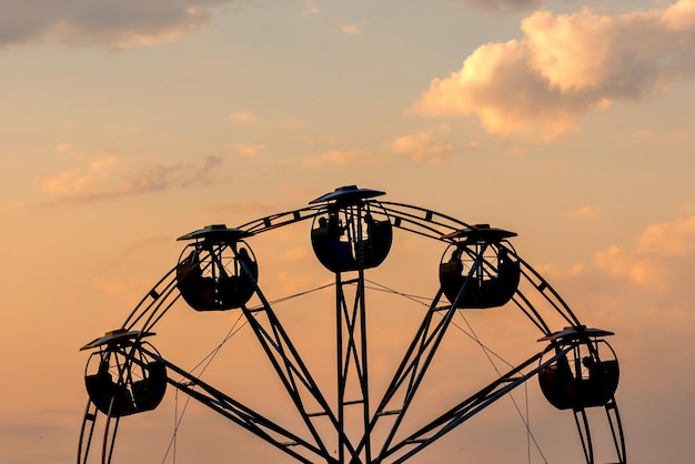 Red sunset with Ferris wheel silhouette