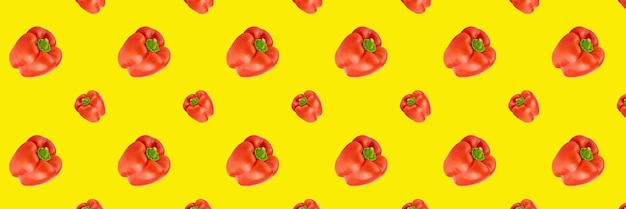 Red sweet paprika multiplied in large quantities on colored background seamless pattern mockup