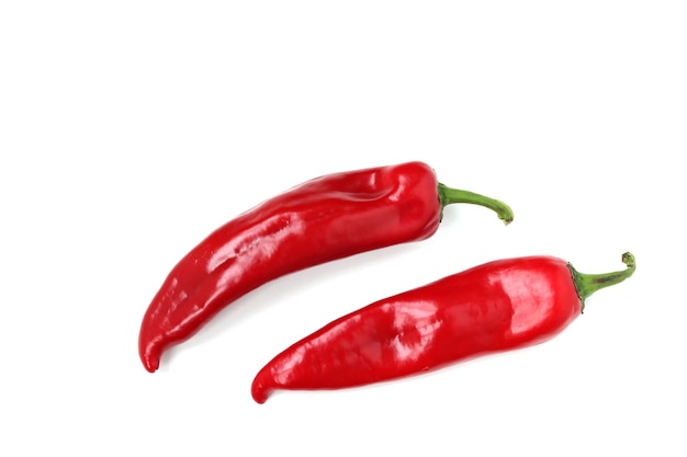 Red sweet pepper is located on a white surface, top view, copy space