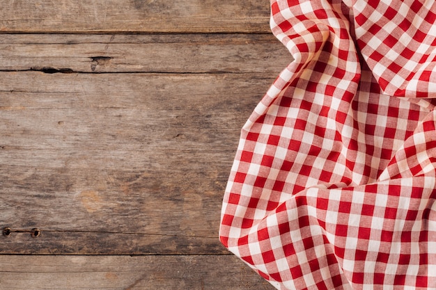 red table cloth on old wooden background