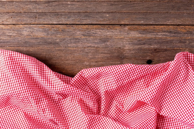 red table cloth on wooden background