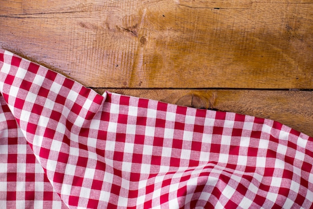 red table cloth on wooden background