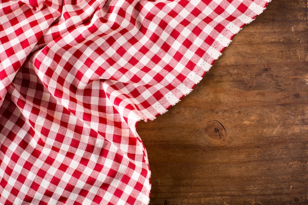 Red table cloth on wooden table