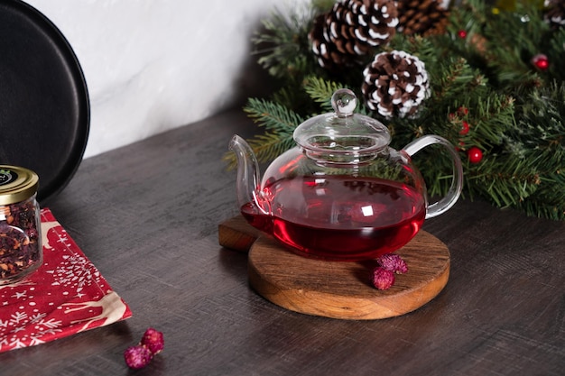 Red tea in a glass teapot