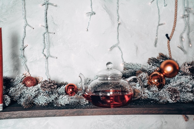 Red tea in a glass teapot