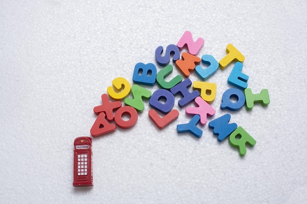 Red telephone booth model and colorful letters