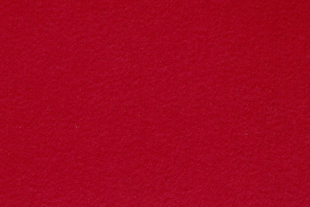 Red textured paper background. High resolution photo.