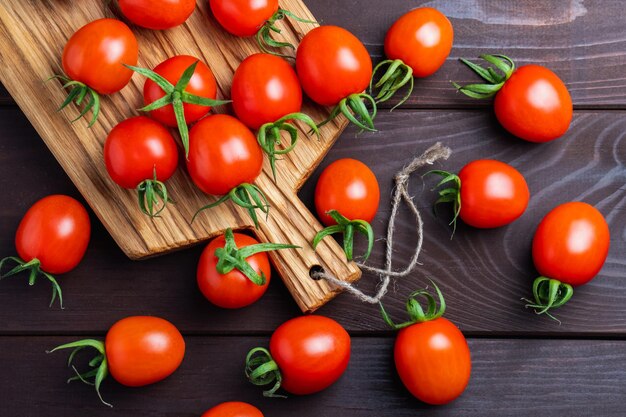 Red tomato in glass bowl on wooden table Organic healthy food Cooking IngredientsPomodoro on desk