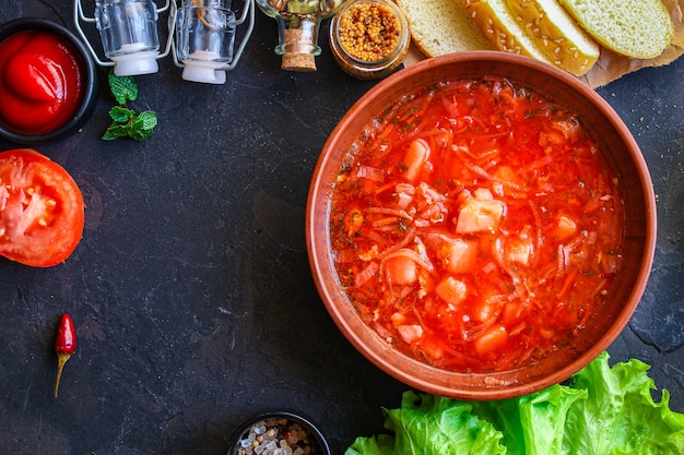 red tomato soup and vegetables and meat, borsch