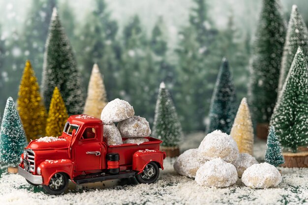 Photo red toy car on snow covered landscape