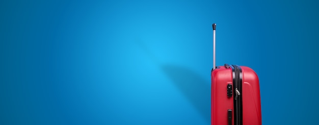 Red travel suitcase over blue