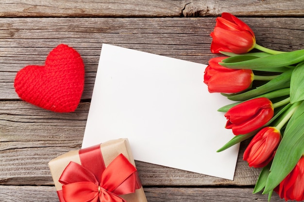 Red tulips gift box and Valentine's day greeting card