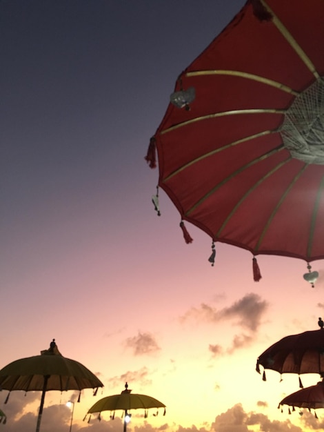 a red umbrella with a yellow stripe on it