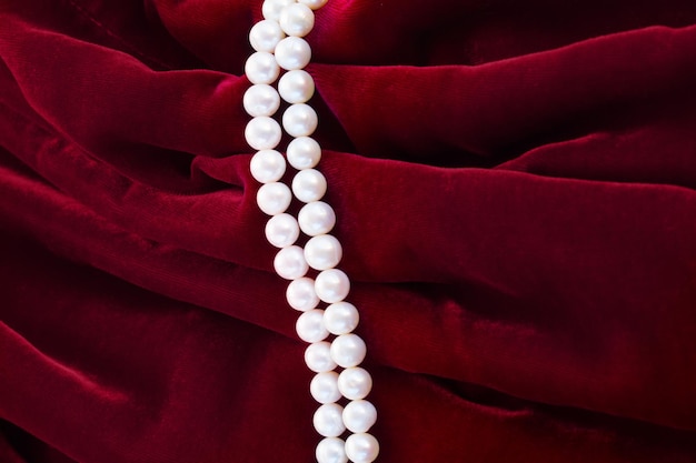 Red velvet background with pearls