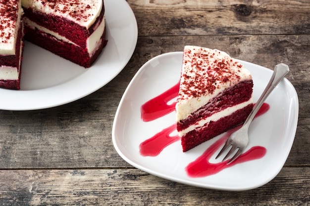 Red Velvet cake slice on wooden table